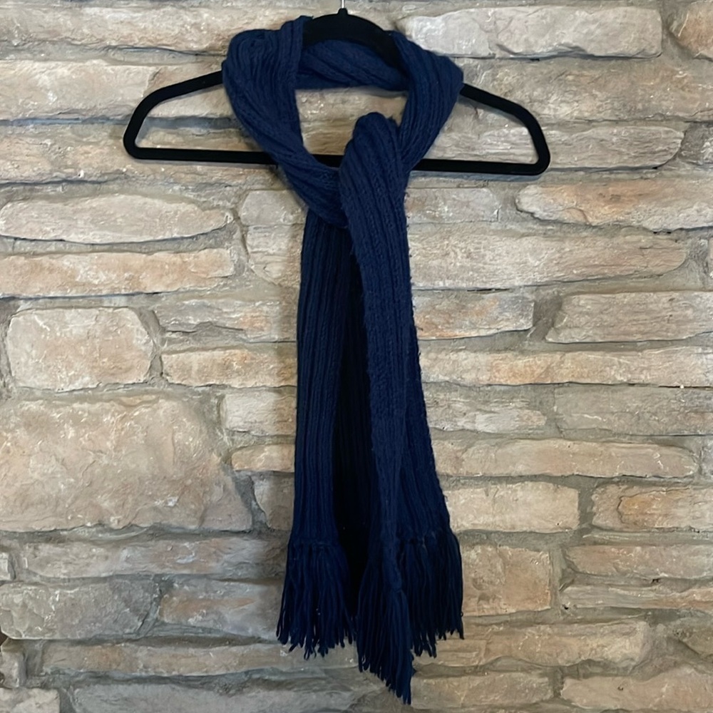 Navy blue scarf with fringe.